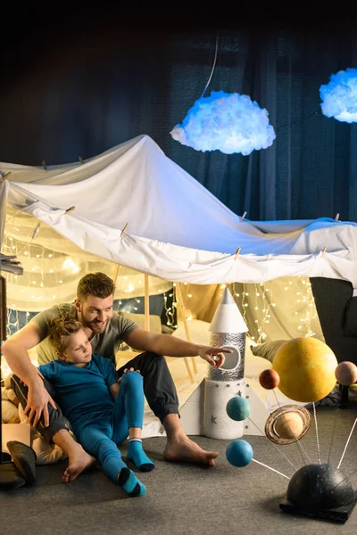 Father and son in blanket fort — Stock Photo