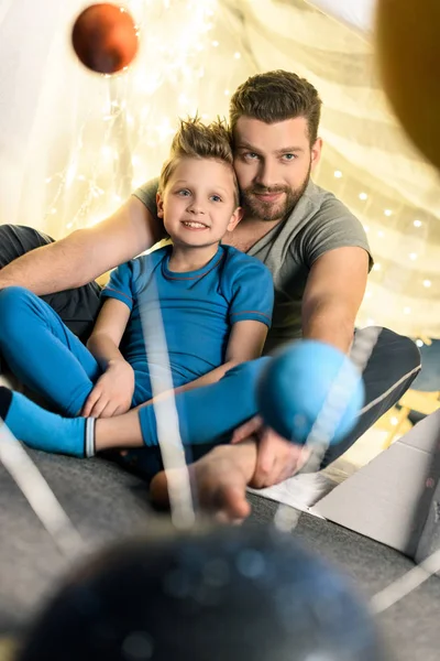 Father and son in blanket fort — Stock Photo