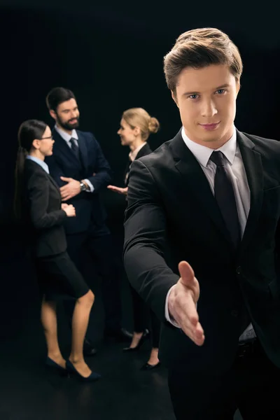 Businessman showing handshake sign — Stock Photo