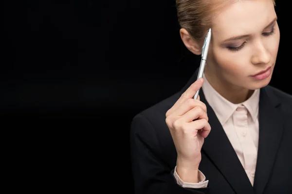 Businesswoman with pen in hand — Stock Photo