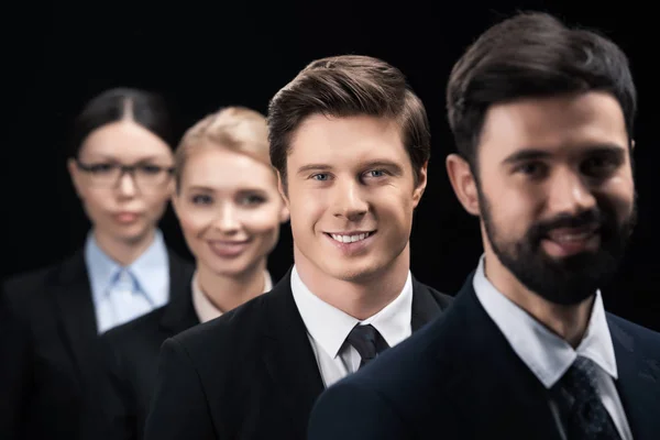 Business people standing in row — Stock Photo