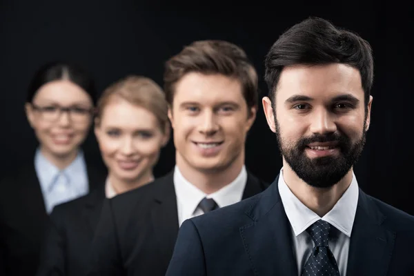 Business people standing in row — Stock Photo