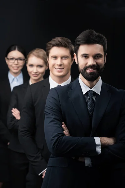 Business people standing in row — Stock Photo