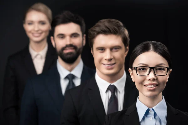 Business people standing in row — Stock Photo