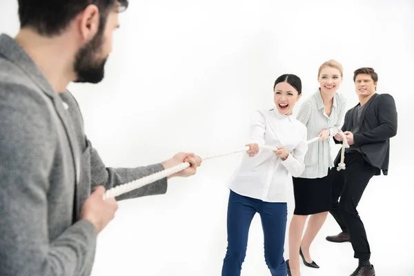 Business people pulling over rope — Stock Photo