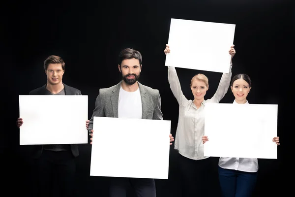 Business people with blank cards — Stock Photo