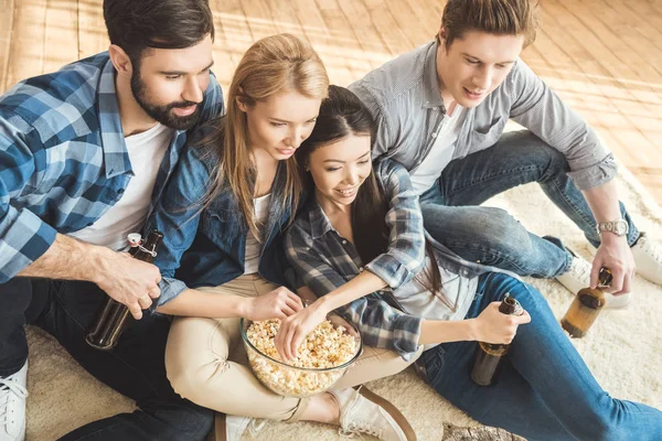 Two couples watching movie — Stock Photo