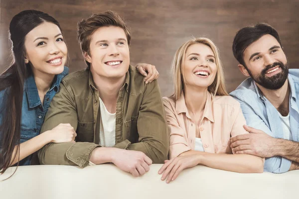 Couples leaning on sofa and daydreaming — Stock Photo