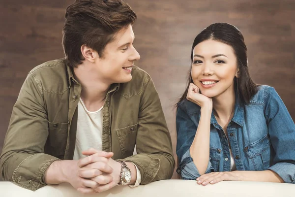 Couple leaning on sofa — Stock Photo