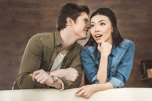 Couple leaning on sofa — Stock Photo