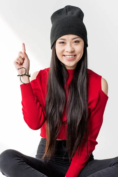 Asian woman pointing up — Stock Photo
