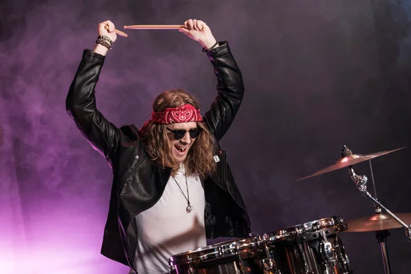 Young musician with drums set — Stock Photo