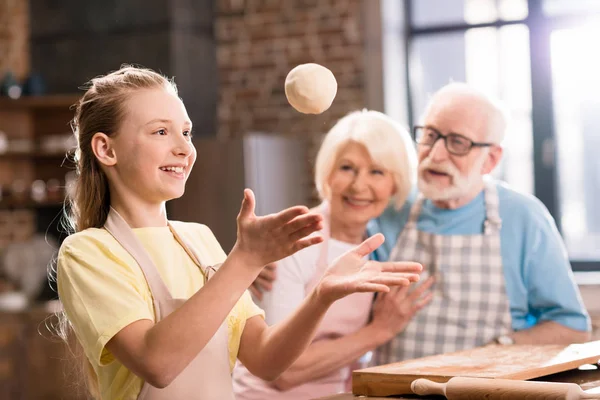 Family kneading dough — Stock Photo