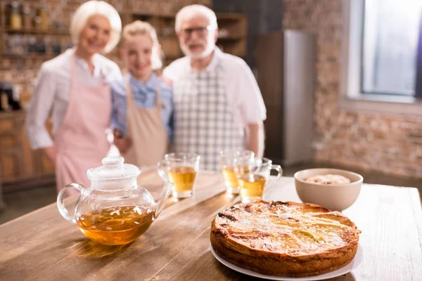 Pie and hot tea on table — Stock Photo