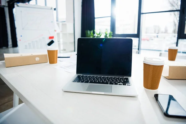 Laptop computer on workplace — Stock Photo