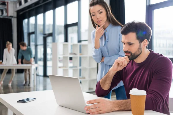 Businesspeople working with laptop — Stock Photo