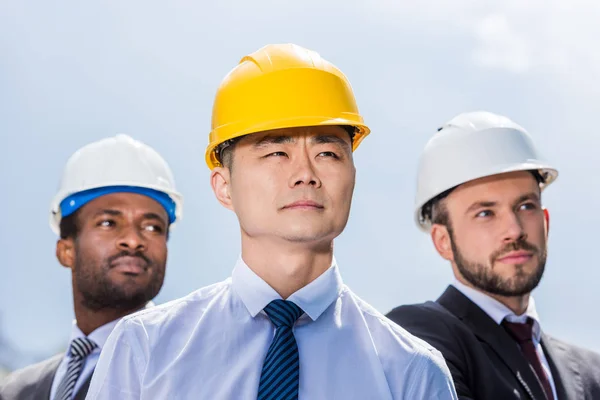 Professional architects in hard hats — Stock Photo