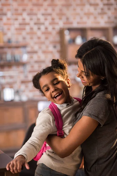 Mother and daughter hugging each other — Stock Photo