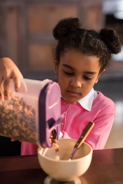 Little girl having breakfast — Stock Photo