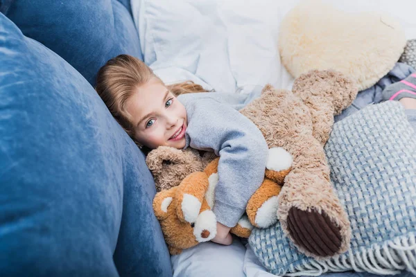 Little girl with teddy bears — Stock Photo