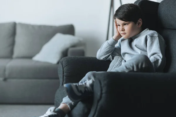 Pensive little kid boy at home — Stock Photo