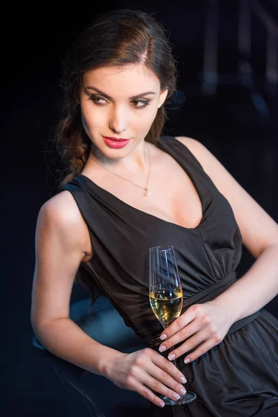 Woman drinking champagne — Stock Photo