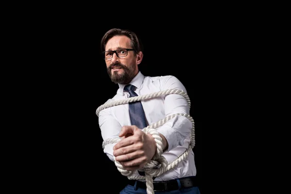 Businessman tied with rope — Stock Photo