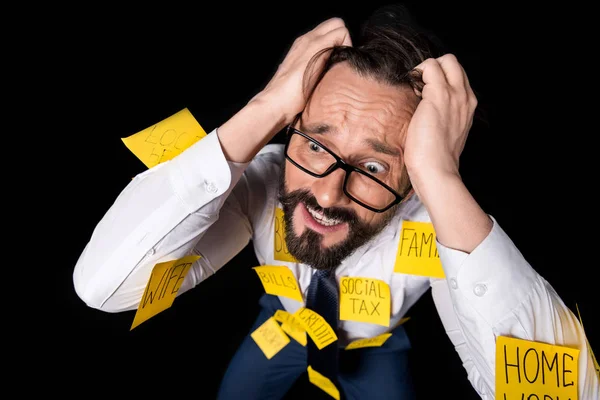 Stressed businessman with sticky notes — Stock Photo