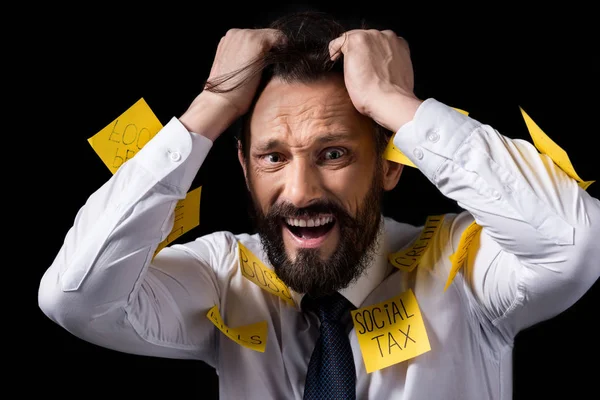 Homme d'affaires stressé avec des notes collantes — Photo de stock