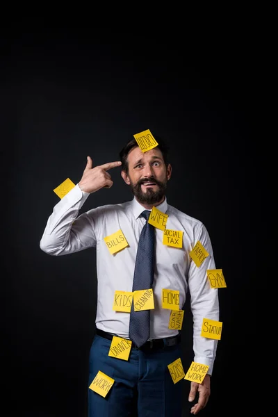 Stressed businessman with sticky notes — Stock Photo