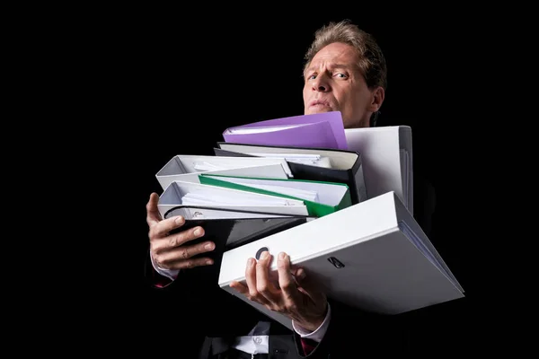 Overworked businessman with folders — Stock Photo