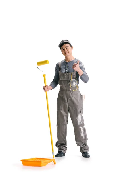 Construction worker with roller brush — Stock Photo