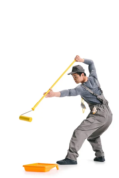 Construction worker with roller brush — Stock Photo