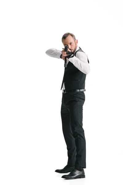 Secret agent in suit with rifle — Stock Photo