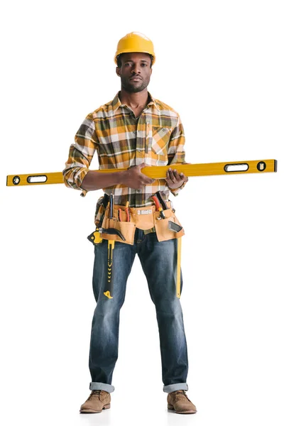 Construction worker with leveling tool — Stock Photo