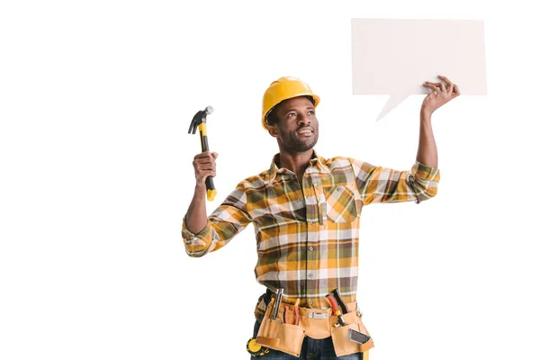 Builder holding blank speech bubble — Stock Photo