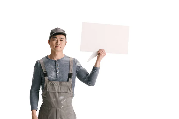 Builder holding blank speech bubble — Stock Photo