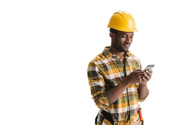 Builder texting messege on smartphone — Stock Photo