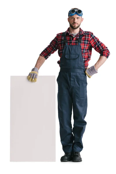 Trabajador de la construcción con banner en blanco - foto de stock