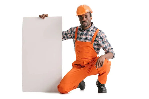 Constructeur avec bannière blanche vierge — Photo de stock
