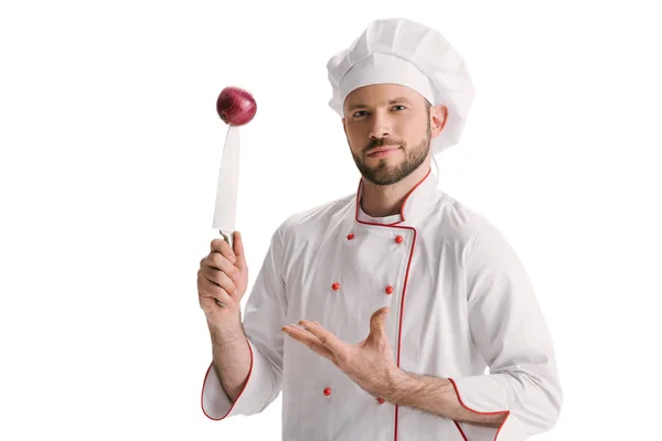 Chef with onion on knife — Stock Photo