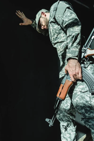 Mourning soldier leaning on wall — Stock Photo