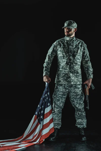 Soldier with united states flag — Stock Photo