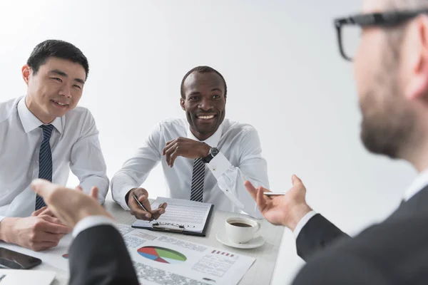 Multiethnic businessmen having discussion — Stock Photo