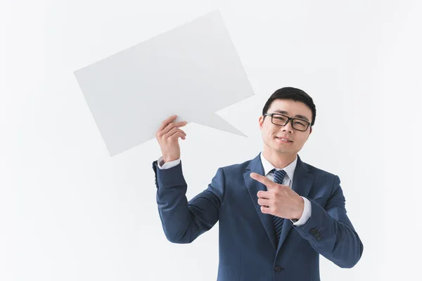 Asian businessman with blank card — Stock Photo