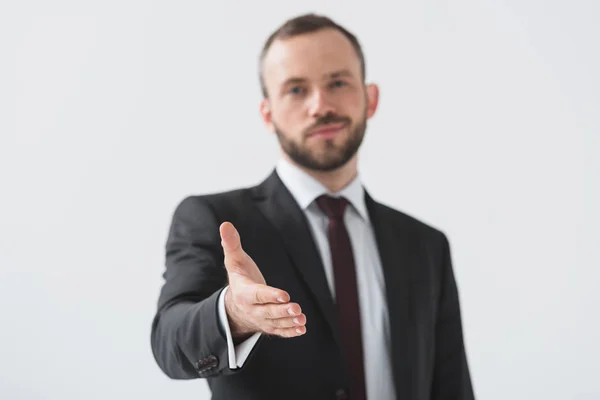 Empresario con la mano extendida - foto de stock