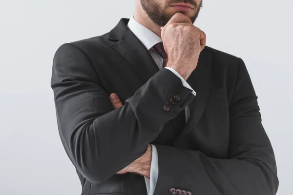 Hombre de negocios pensativo en traje - foto de stock