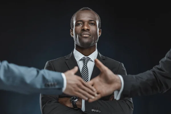 Multiethnic business partners shaking hands — Stock Photo