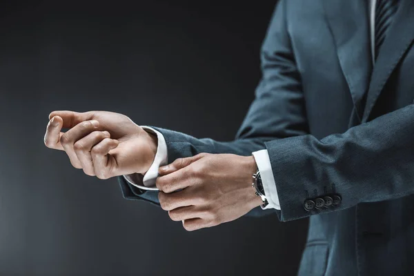 Businessman buttoning shirt — Stock Photo