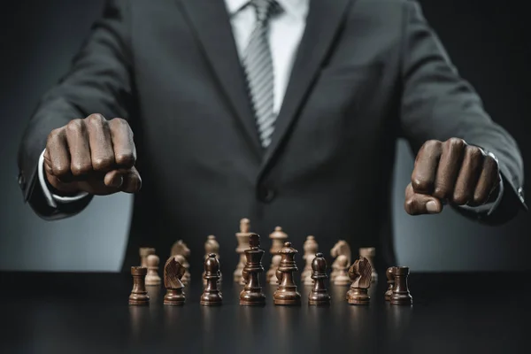 African american businessman and chess figures — Stock Photo